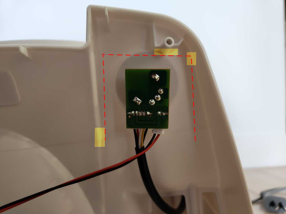 The new PCB mounted inside the fan. Dashed red lines and yellow highlighted rectangles indicate protrusions in the housing which constrained possible board dimensions.